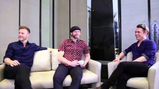 Mark Owen's laughing during an interview in Thailand