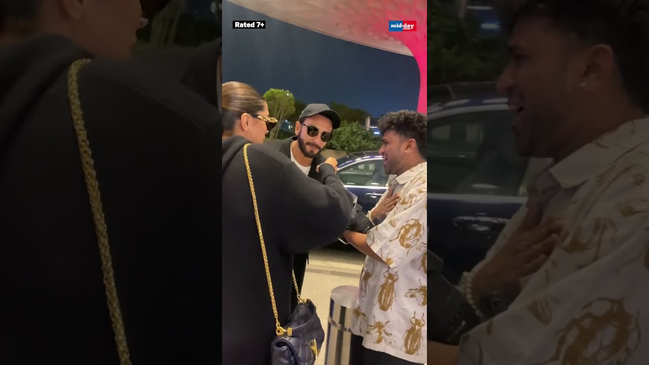 Deepika Padukone cuts a birthday cake with paparazzi