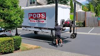 loading a pod on a driveway with a slope