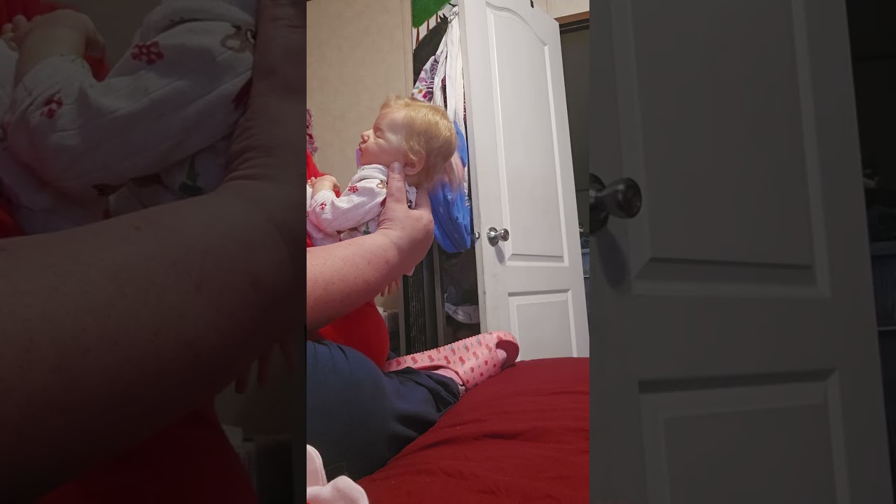 Taking Laura out of her Christmas outfit. 