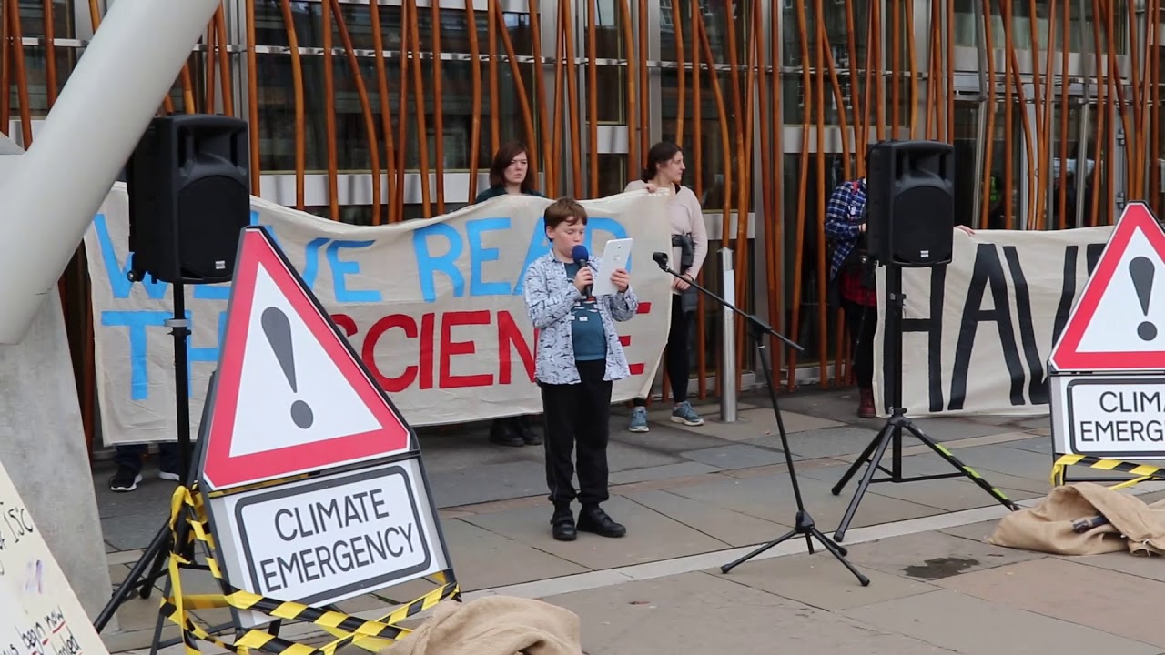 Finlay reading the IPCC report at Holyrood