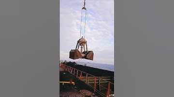 Loading coal progress fm barges to ships by ships crane #shortvideo #coal #loadingcoal #shorts