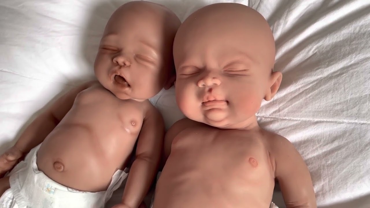 Comparing the size and details of my two silicone snuggle babies