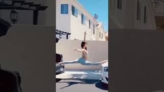 Performance Gymnast - Makes Sou Between Cars