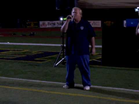 John Knapp sings the National Anthem before the Pi...