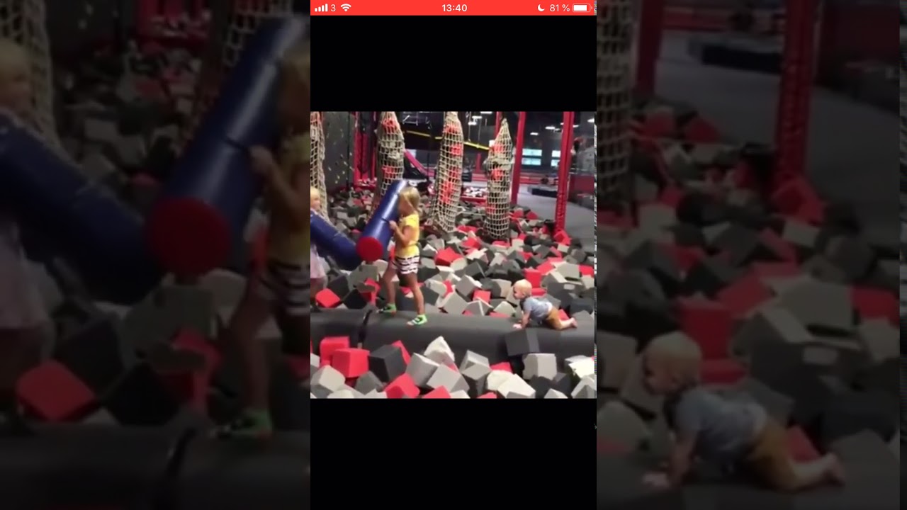 Girl pushes baby into foam pit