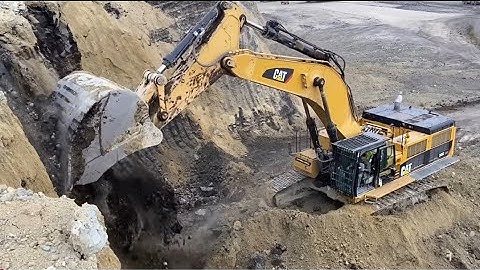 Caterpillar 385C Excavator Loading Overburden On Trucks At Busy Mining Site - Sotiriadis/Labrianidis