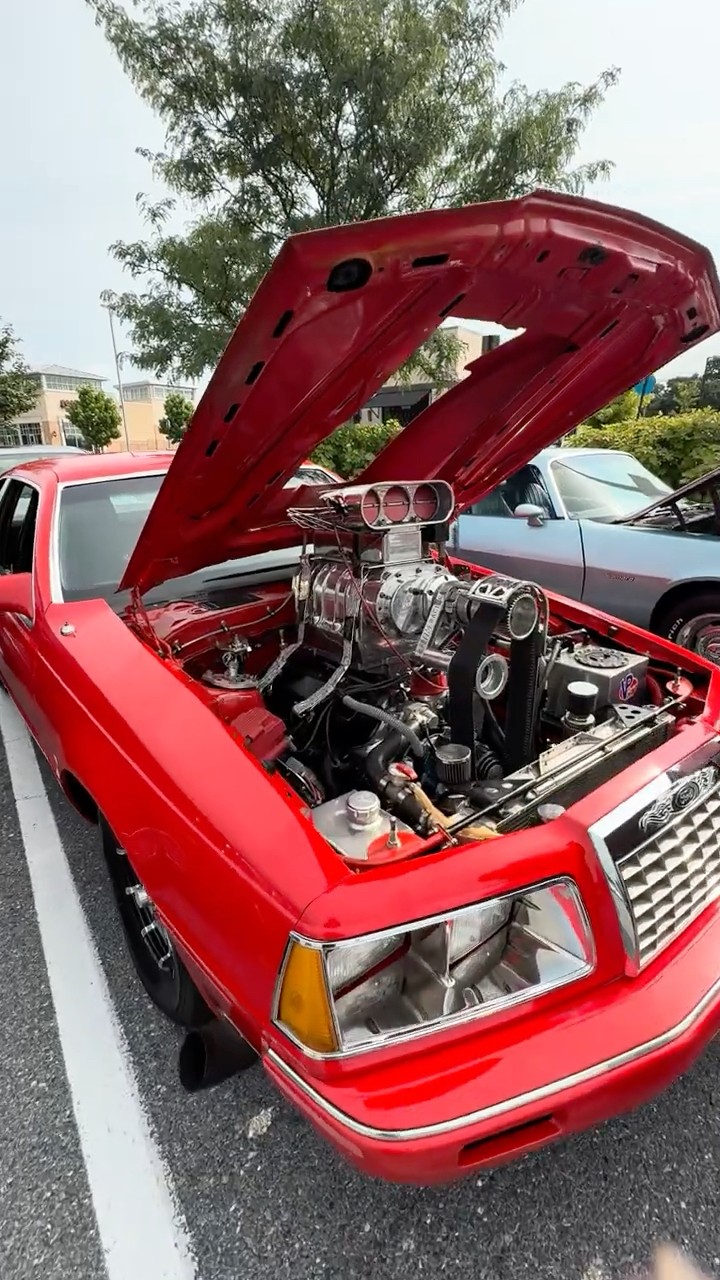 1984 Ford Thunderbird with a massive blower on top of the engine