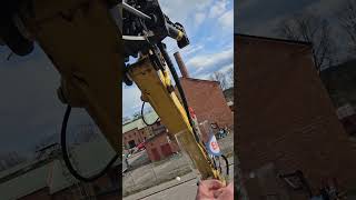 Excavator Driver Delivers a Drink to a Second Story Deck