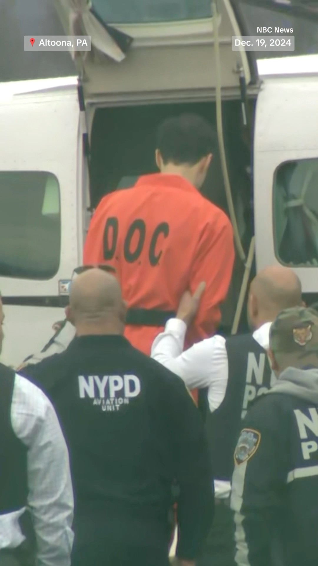 Luigi Mangione boards flight to New York after waiving extradition.