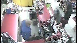 RAW VIDEO: Three masked men rob a Quik Mart with a knife and a shot gun