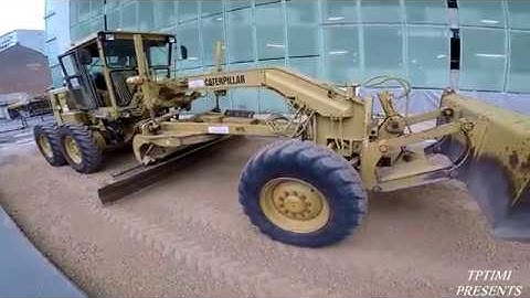 Old Caterpillar Motor Grader Grading The Road -Skilled Operator
