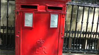 iconic British 'pillar box' Royal Mail box near Westminster Abbey in London, UK 5/26/23