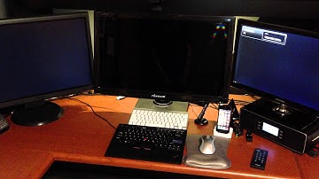 Triple-monitor docked-laptop configuration, showing Nixeus both waking up, and going to sleep.