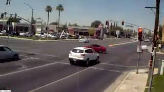 The bakersfield police department released video of near-miss red
light runners in city.