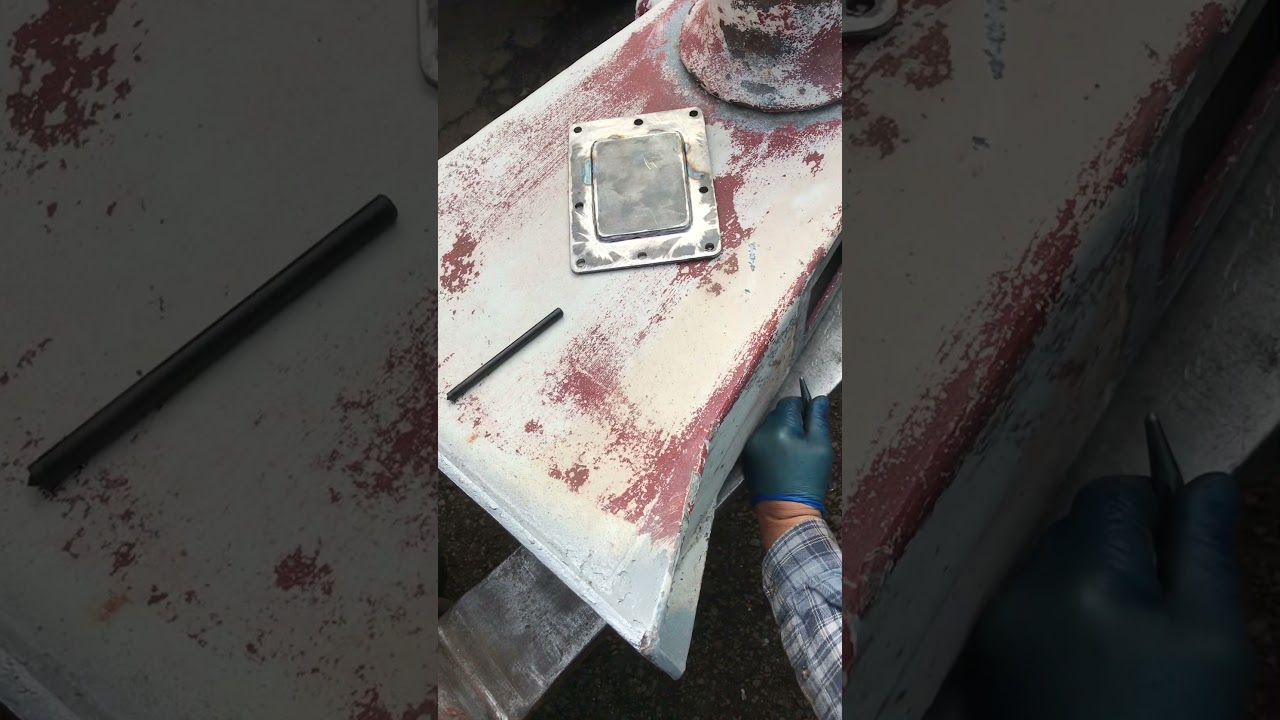 Preparing to drill and tap holes for the new winch cover plate