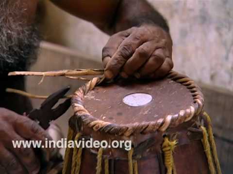 Mridangam making Indian percussion instrument