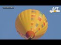 First Ever: Mountain Biker Rides on Top of a Flying Hot Air Balloon | APT Sports