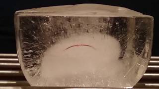 ''Cutting'' ice with thin wire: time lapse