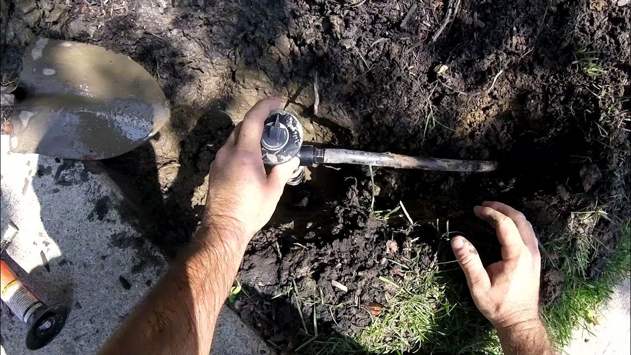 Changing a sprinkler head for a taller one so it can spray over