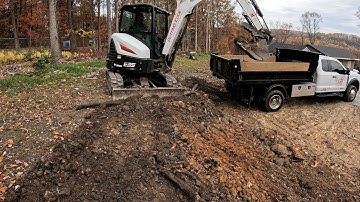 Finishing up this backyard expansion with the bobcat e35... What a difference a day can make!