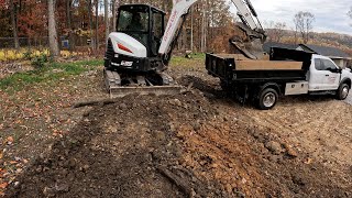 Finishing up this backyard expansion with the bobcat e35... What a difference a day can make!