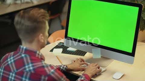Business Man Typing on Computer with Green Screen. Young Man Working on Computer | Stock Footage...