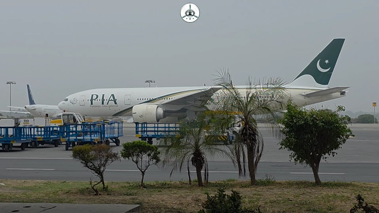 Plane Spotting in the rain at Lahore Airport