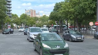 Fin des moteurs thermiques en 2035: réactions d'automobilistes à Paris | AFP