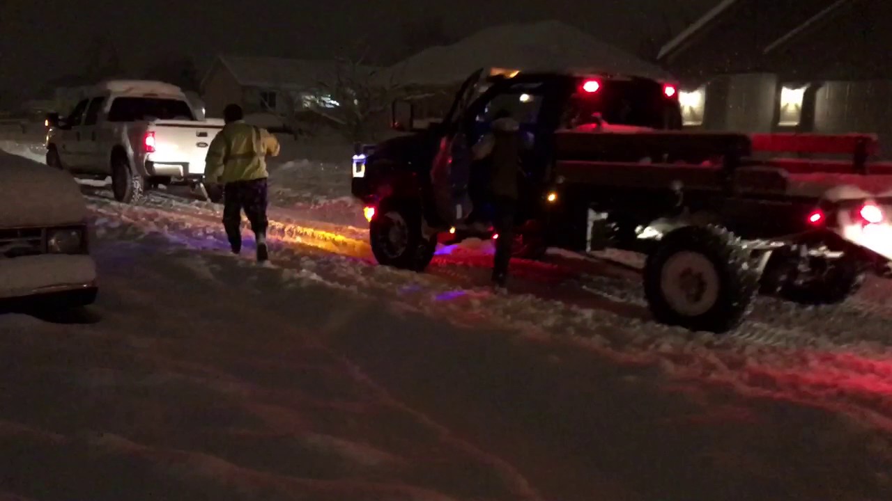 Cummins and powerstroke pulling stuck semi in deep snow - YouTube