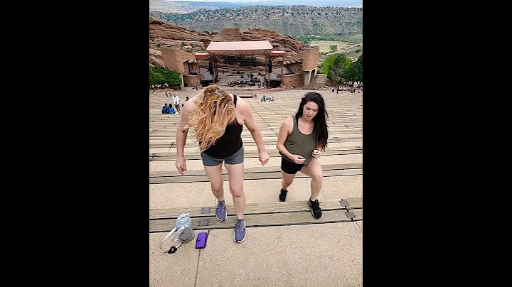 daughter teaching mother how to stretch and work o...