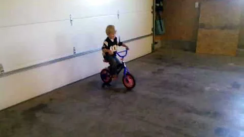 Elijah riding his bike without training wheels--3 years.