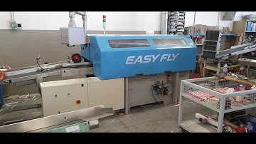 Easy Fly - Year 2006. Knife trimmer to cut face-side book.