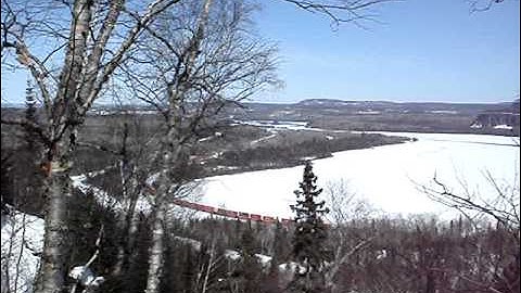 Nipigon hiking trail  watching C.P.R. train going around Stillwater Bay heading for Nipigon