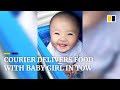 Delivery courier in China goes to work with baby girl in tow