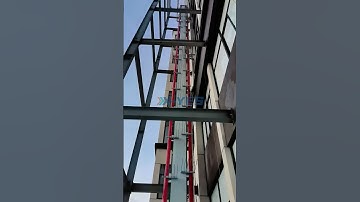 Customized Vertical Conveyor System: Maximizing Space, Empowering Efficiency