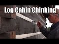 Chinking the log Cabin