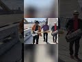 Stylish Trio Rocks a Bridge: Music Meets Cityscape Vibes #shorts