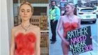 Vegan activist Tash Peterson protests topless outside court in Perth