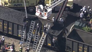 Person trapped in train car full of coal