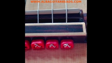 Alba guitar beads red beads ties blocks for nylon string flamenco guitars www.albabuitarbeads.com