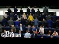 Brexit party MEPs turn their backs during European anthem at parliament's opening session