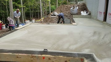 Coloring concrete with color hardener.