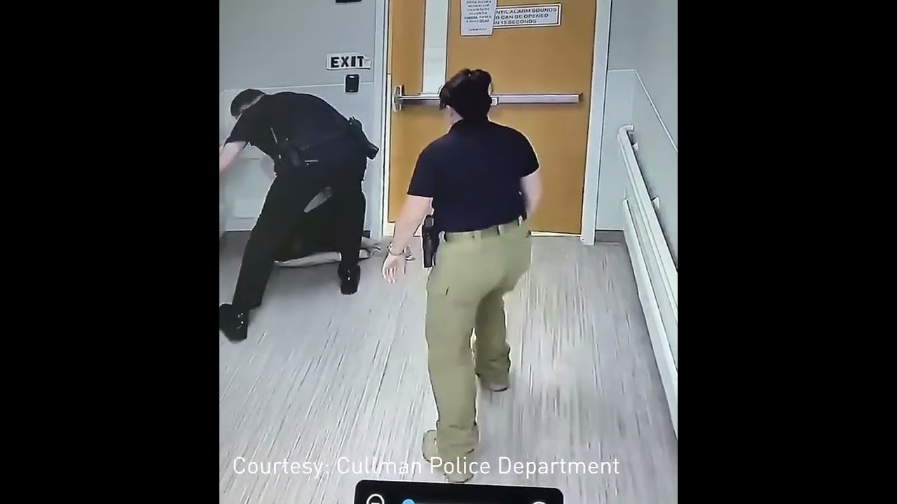 Man Being Escorted By Police Tries To Grab Officer S Gun