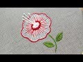 Hand embroidery of a flower with buttonhole stitch and french knots
