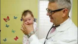 How To Calm A Crying Baby - Dr. Robert Hamilton Demonstrates 'The Hold'