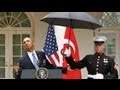 King Obama Calls Marines To Hold His Umbrella