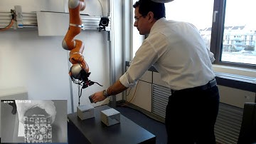 Visually guided object tracking and grasping in nonmetric space