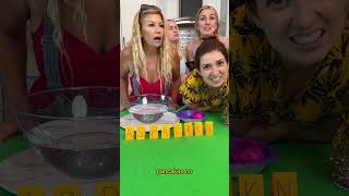 Girls play egg scoop game.