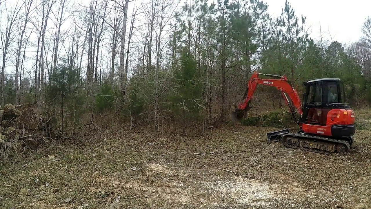 Clearing with mini excavator (Time Lapse)  (Kubota KX057)